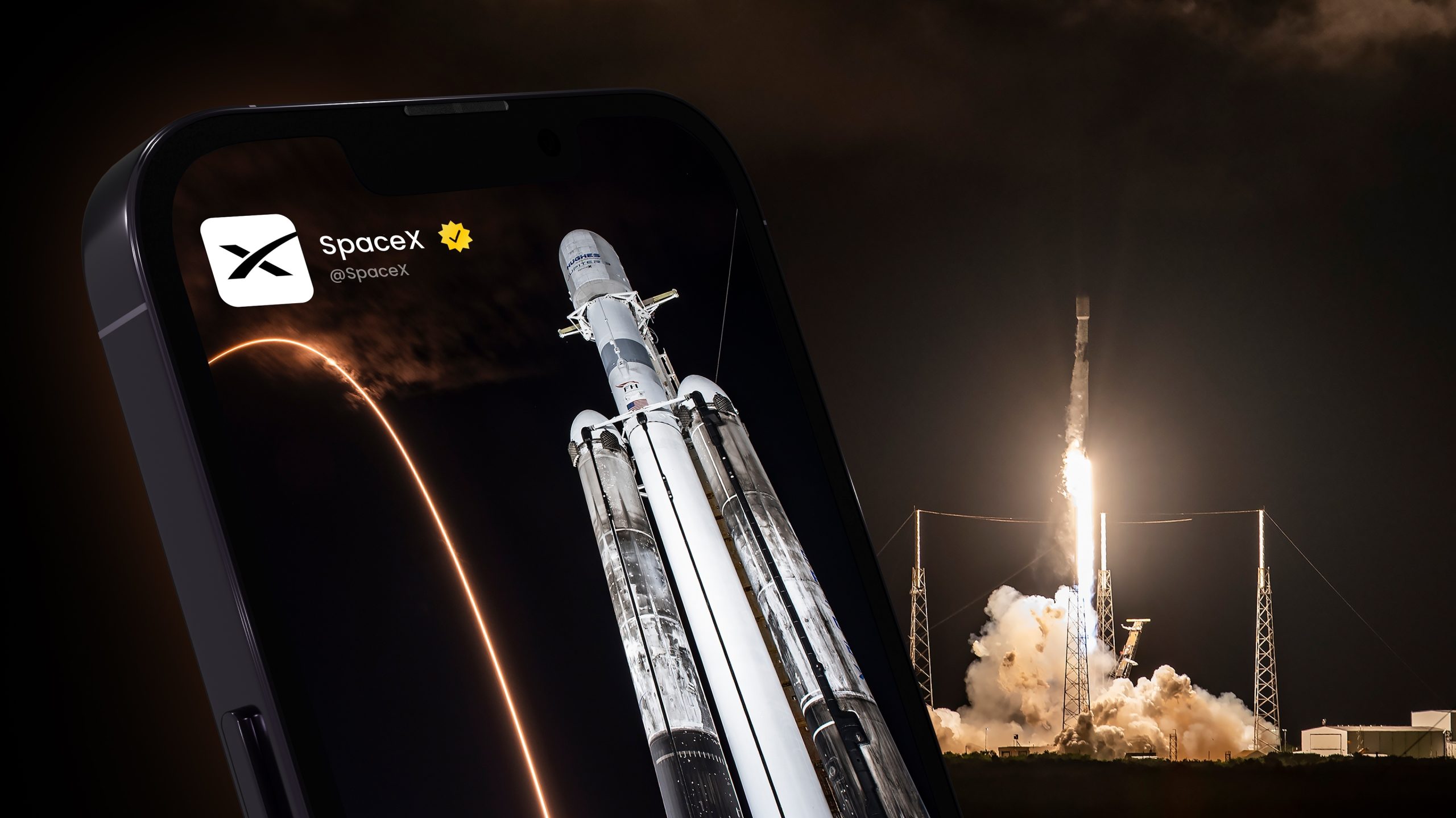 Smartphone screen showing a SpaceX rocket ready for launch against a dark sky with a glowing arc in the background.